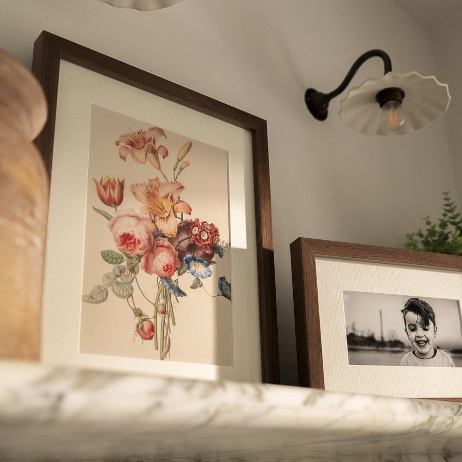 The Honeysuckle, a walnut frame on a shelf