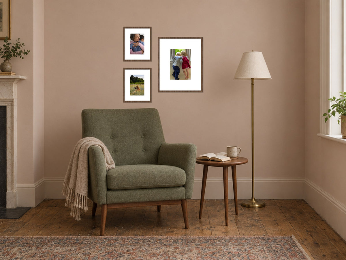 The Keswick Alcove Set in walnut, hung beside a green armchair