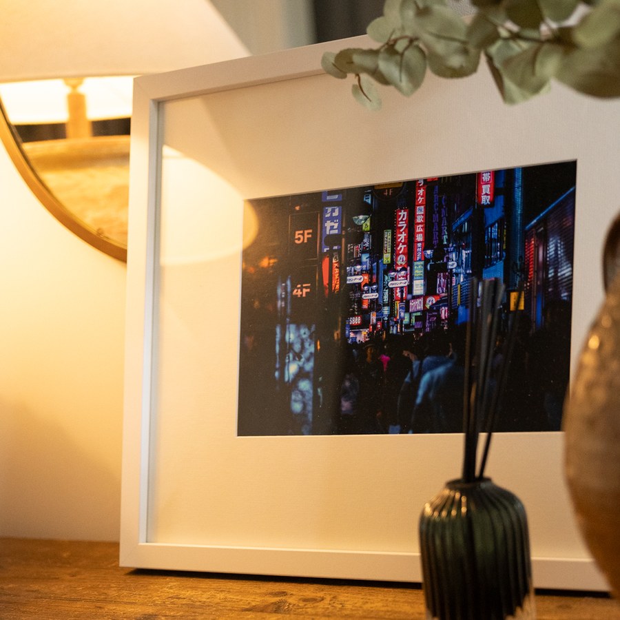 The Orchid, a white frame on a table